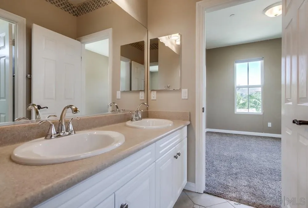 16123 Cayenne Ridge Road San Diego, CA 92127 - Photo 31 of 41 a bathroom with a sink and a mirror