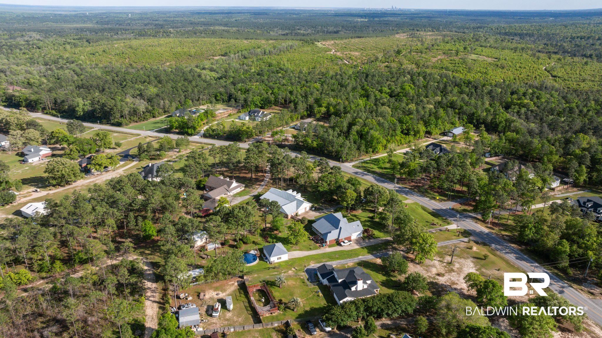 3100 Radcliff Road Saraland, AL 36571 - Photo 62 of 65 Birds eye view of property featuring a view of trees