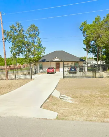 a house with trees in front of it