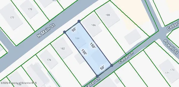 a view of a hallway with large windows