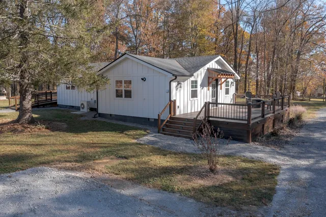 a kitchen with stainless steel appliances wooden cabinets and a stove top oven