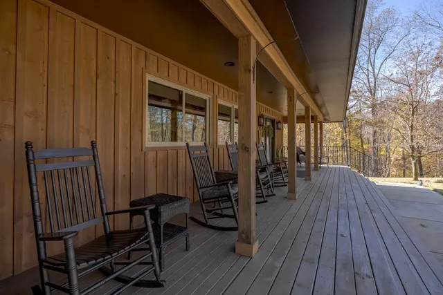 a bedroom with a large bed and a large window