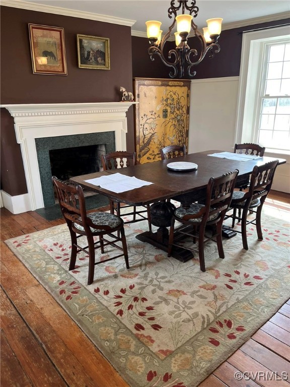 562 Newcomb Bridge Road Chase City, VA 23924 - Photo 13 of 39 a view of a dining room with furniture and chandelier