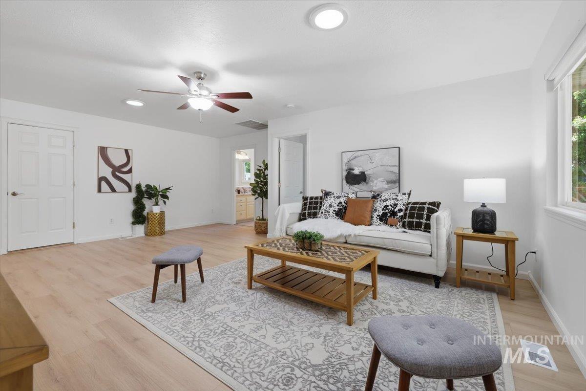 2075 North Springland Place Boise, ID 83713 - Photo 18 of 49 Bright living area featuring wood-finish flooring, recessed lighting, and a ceiling fan