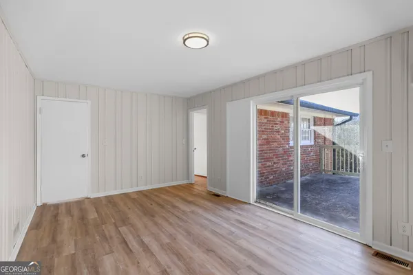 a view of entryway with wooden floor