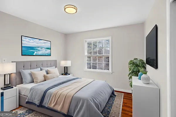 a bedroom with bed and a window