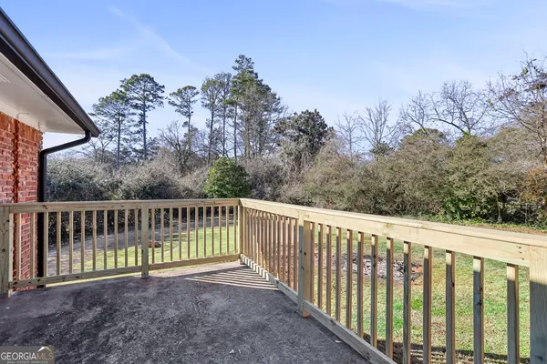 a view of a fence with a yard