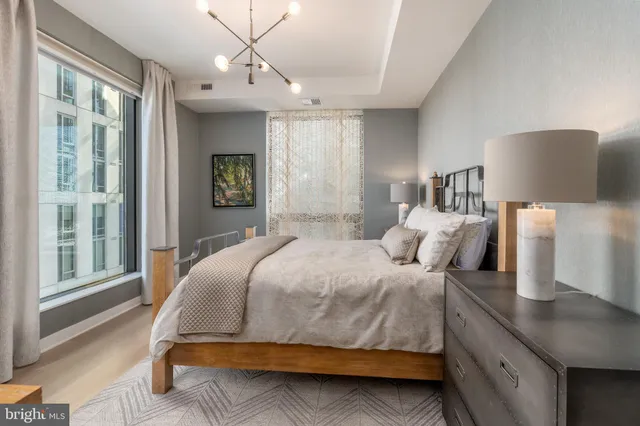 a bedroom with a large bed and a window