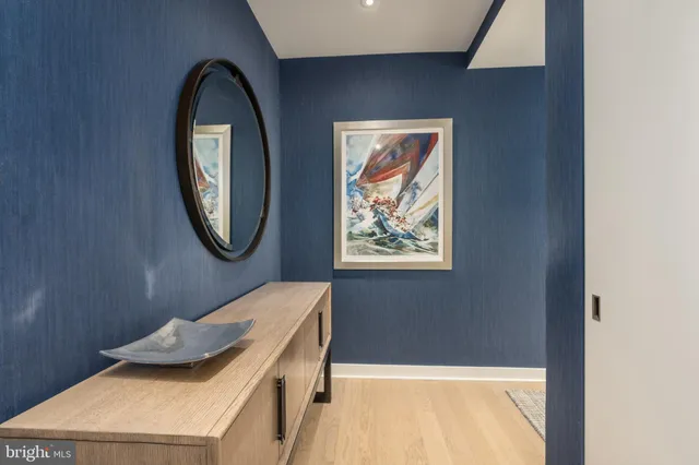 a bathroom with a tub and a mirror