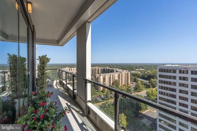 a view of a balcony with chairs
