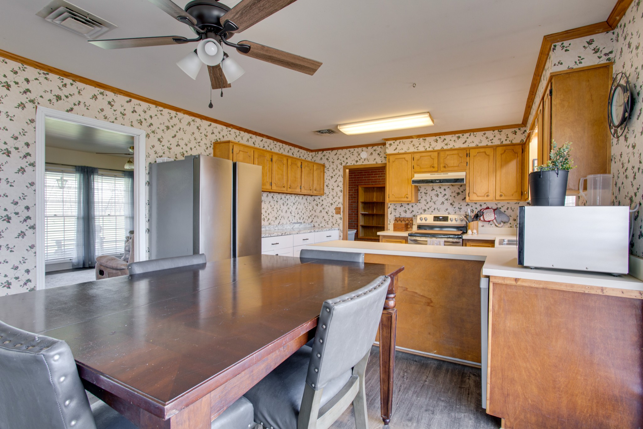 350 Flat Woods Road Lebanon, TN 37090 - Photo 11 of 33 a kitchen with stainless steel appliances granite countertop a sink a stove and refrigerator