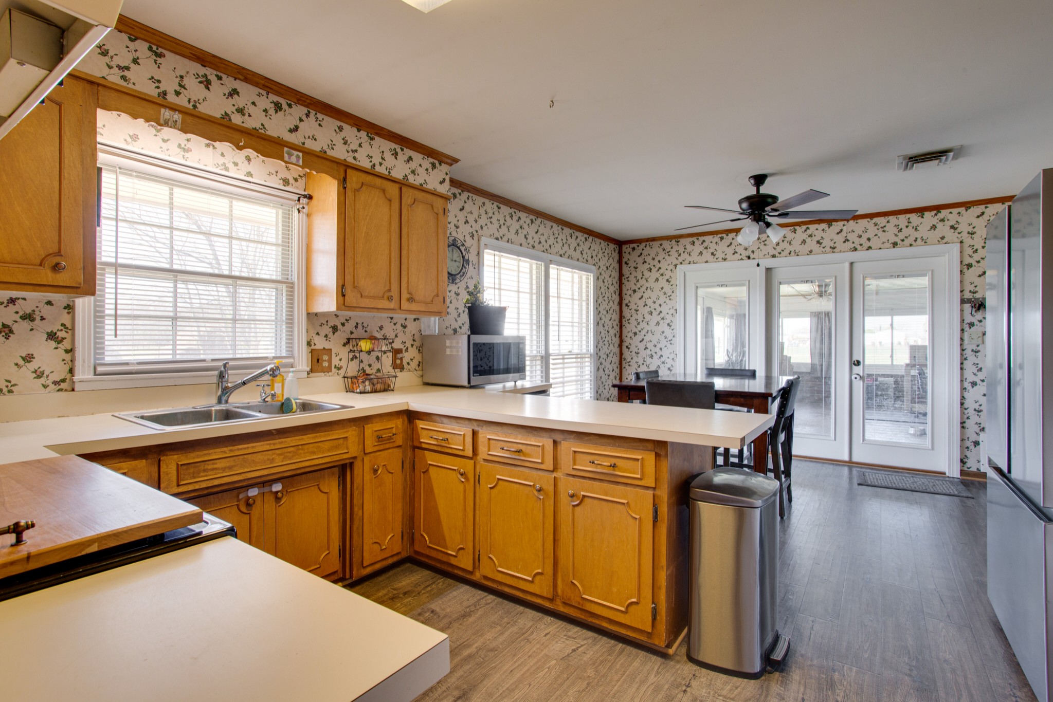 350 Flat Woods Road Lebanon, TN 37090 - Photo 15 of 33 a kitchen with sink cabinets and wooden floor