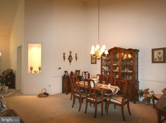 333 Colony Point Place Edgewater, MD 21037 - Photo 2 of 11 a dining room with furniture and chandelier