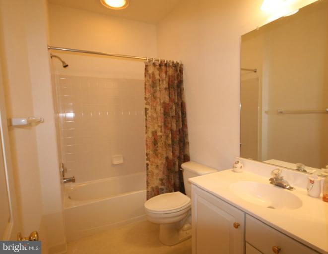 333 Colony Point Place Edgewater, MD 21037 - Photo 3 of 11 a bathroom with a sink toilet and shower
