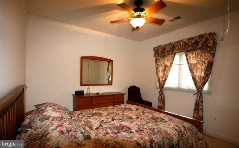 333 Colony Point Place Edgewater, MD 21037 - Photo 4 of 11 a bedroom with a bed and a window