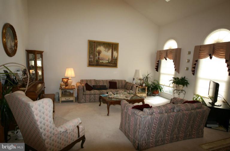 333 Colony Point Place Edgewater, MD 21037 - Photo 6 of 11 a living room with furniture a lamp and a large window