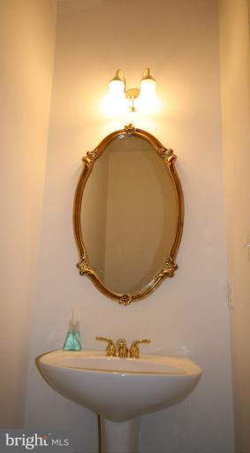 333 Colony Point Place Edgewater, MD 21037 - Photo 8 of 11 a bathroom with a sink and mirror