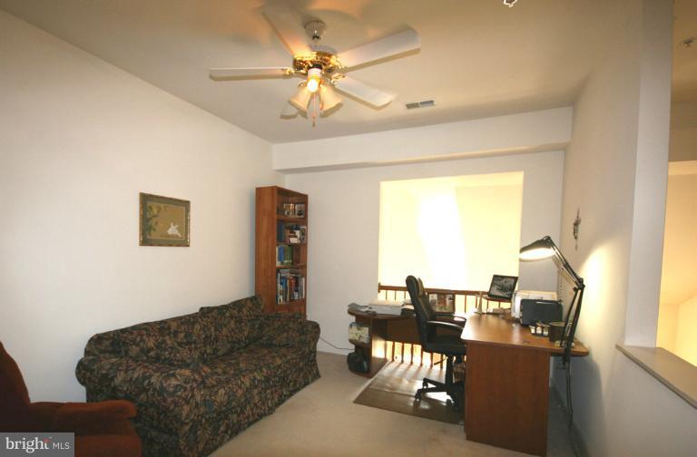 333 Colony Point Place Edgewater, MD 21037 - Photo 10 of 11 a living room with furniture and a large window