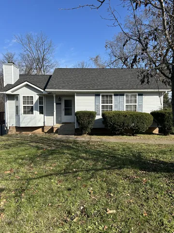 front view of a house with a garden