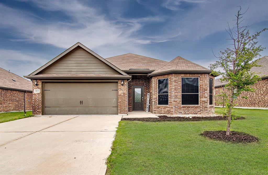 a front view of a house with a yard and porch