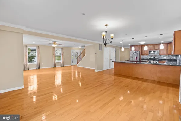 a view of a kitchen with a sink and a kitchen view