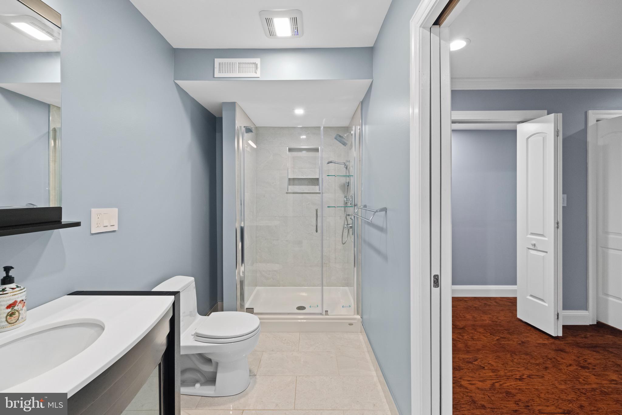 5402 Odell Road Beltsville, MD 20705 - Photo 15 of 69 a bathroom with a sink a toilet and shower