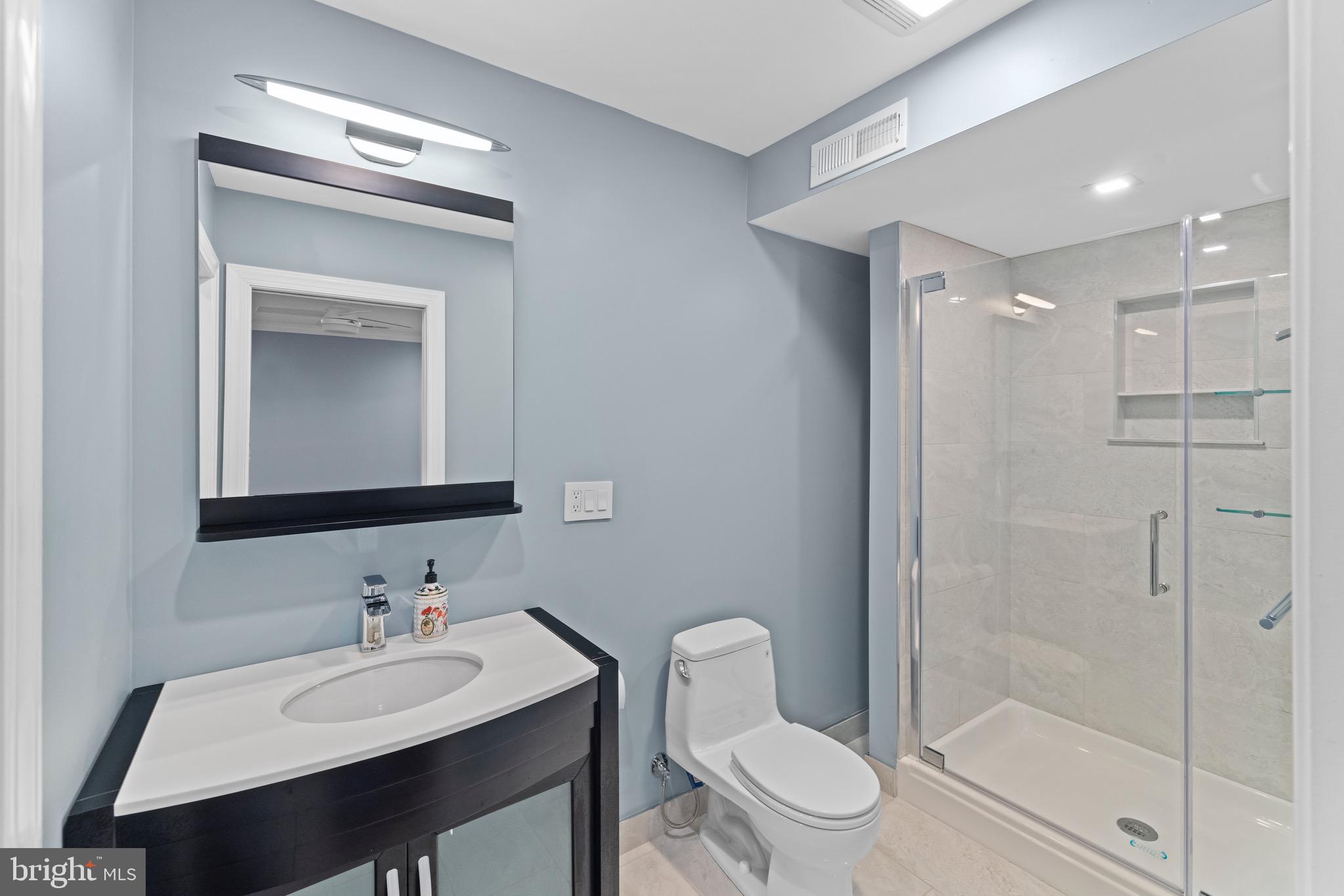 5402 Odell Road Beltsville, MD 20705 - Photo 16 of 69 a bathroom with a sink toilet and shower