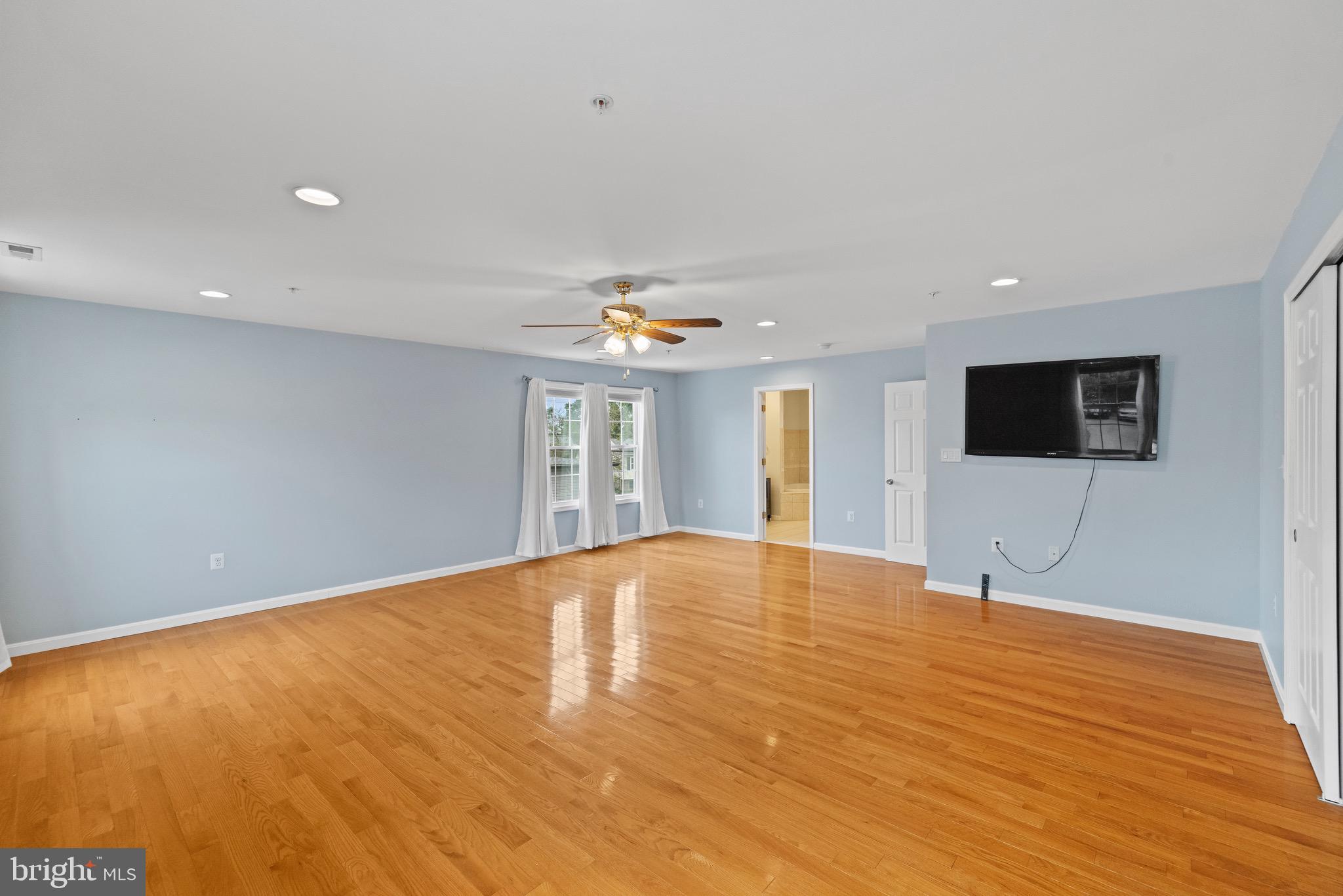 5402 Odell Road Beltsville, MD 20705 - Photo 28 of 69 a view of an empty room with window and wooden floor