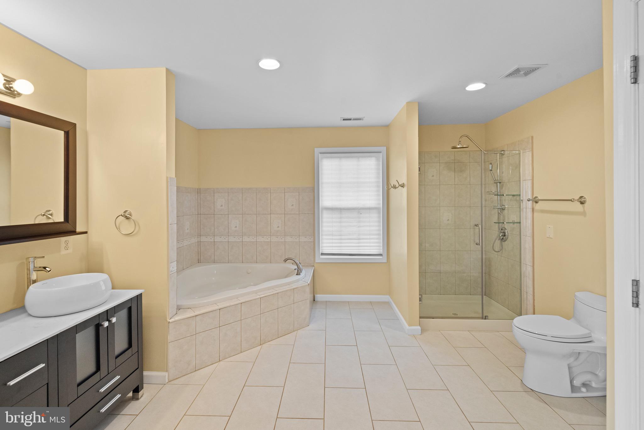 5402 Odell Road Beltsville, MD 20705 - Photo 29 of 69 a bathroom with a sink a toilet and shower