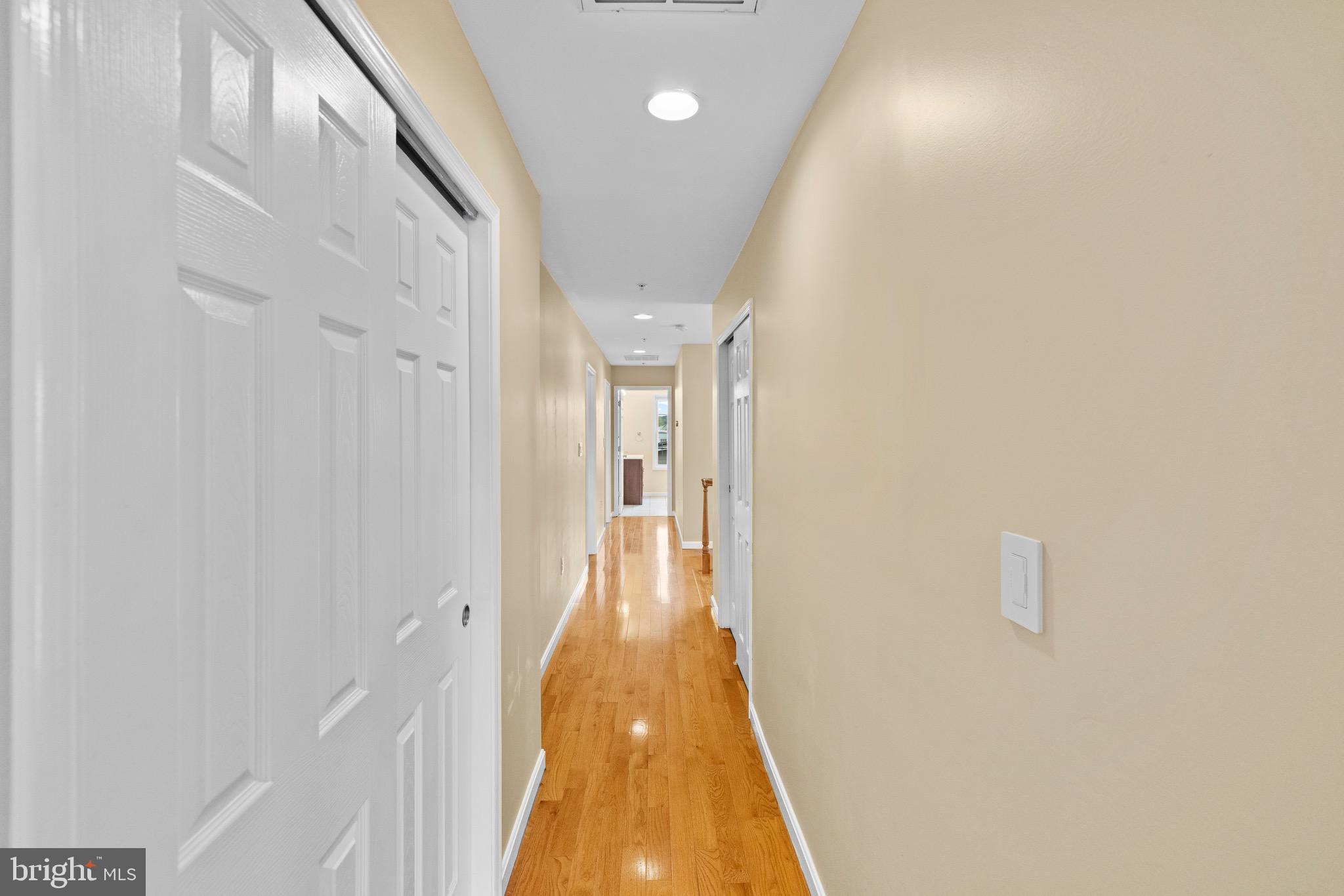 5402 Odell Road Beltsville, MD 20705 - Photo 32 of 69 a view of a hallway with wooden floor