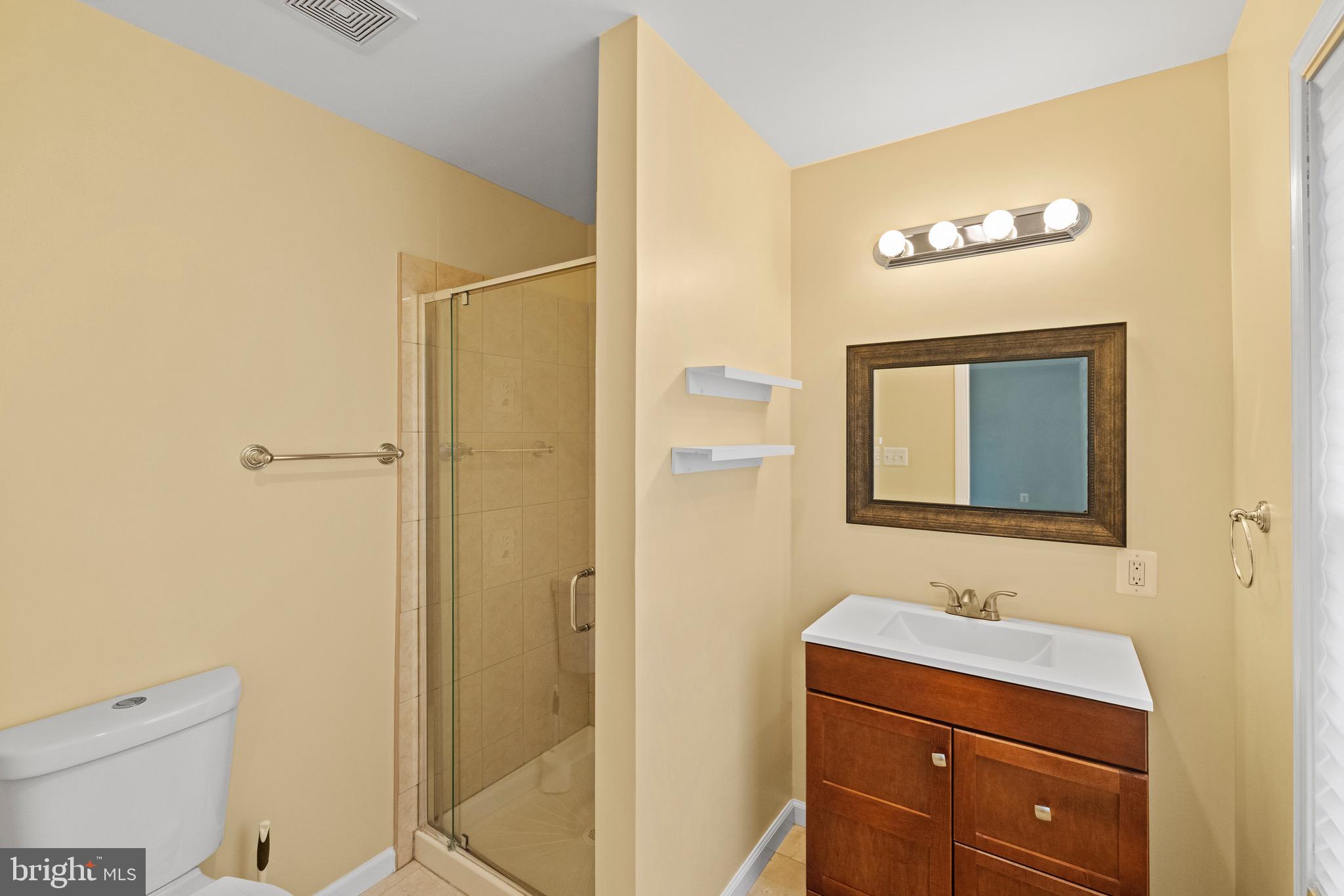 5402 Odell Road Beltsville, MD 20705 - Photo 33 of 69 a bathroom with a sink a toilet and shower