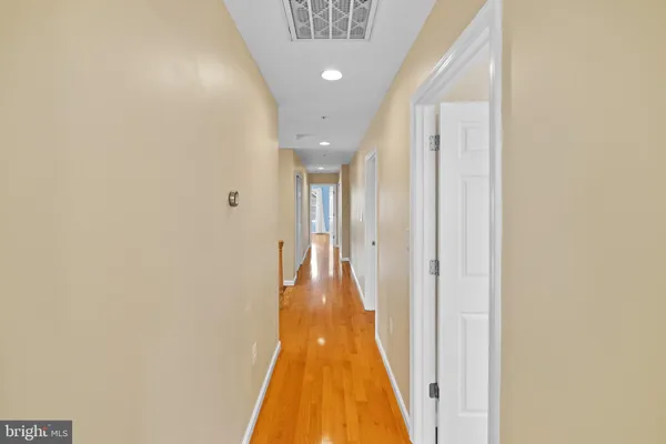 a view of a hallway with a chandelier