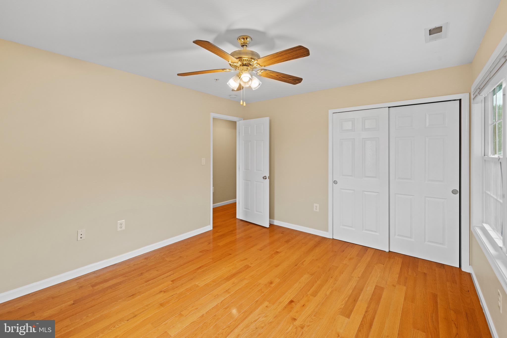 5402 Odell Road Beltsville, MD 20705 - Photo 38 of 69 a view of a big room with wooden floor and windows in a room