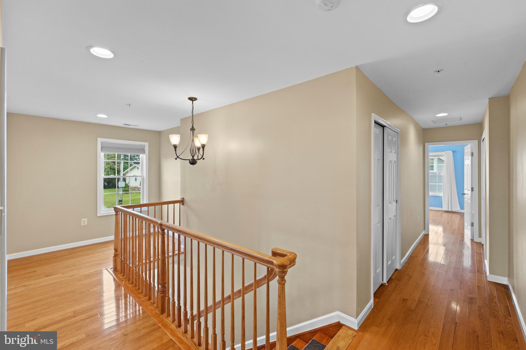 5402 Odell Road Beltsville, MD 20705 - Photo 46 of 69 a view of a hallway with wooden floor and staircase