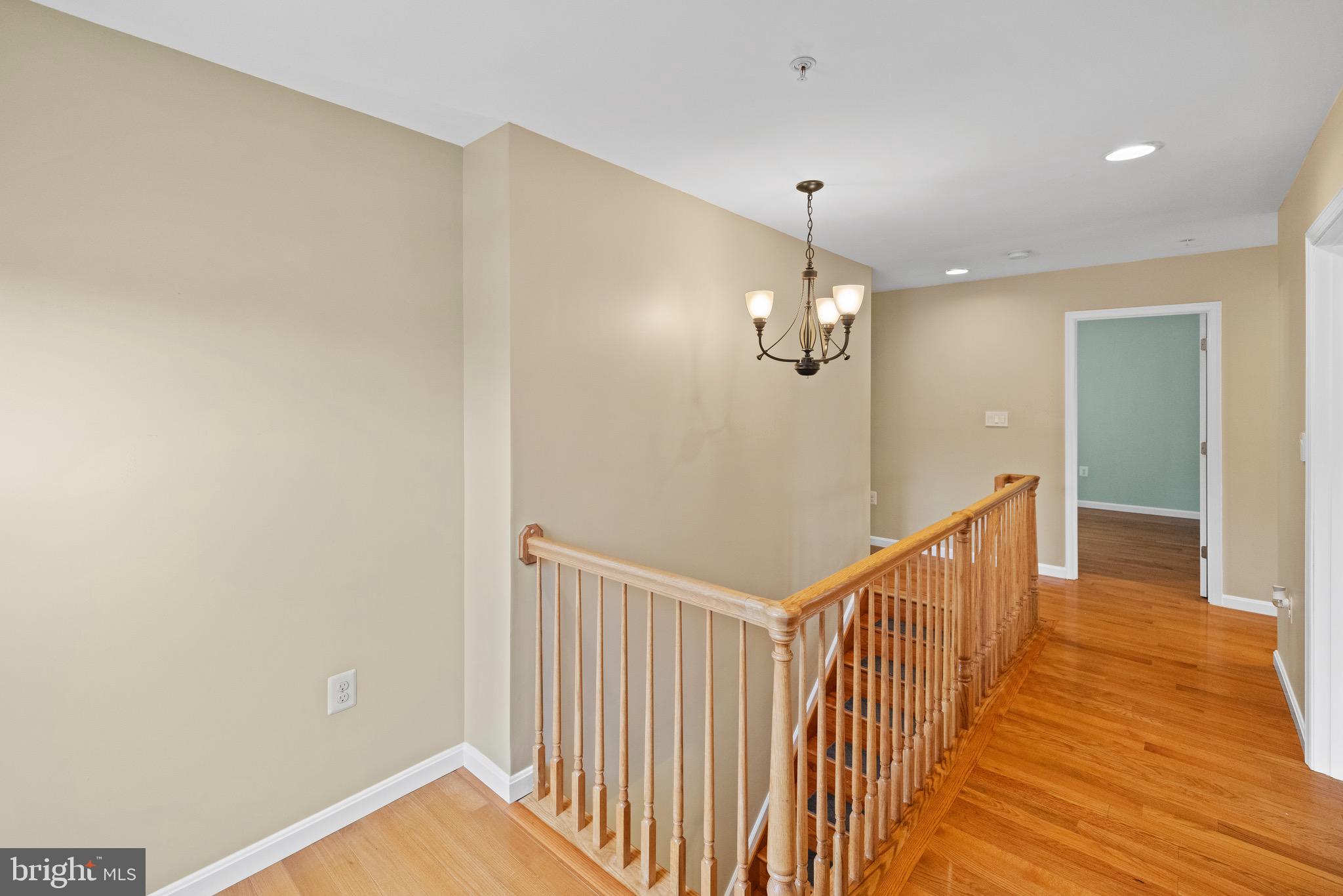 5402 Odell Road Beltsville, MD 20705 - Photo 47 of 69 a view of a hallway with a chandelier