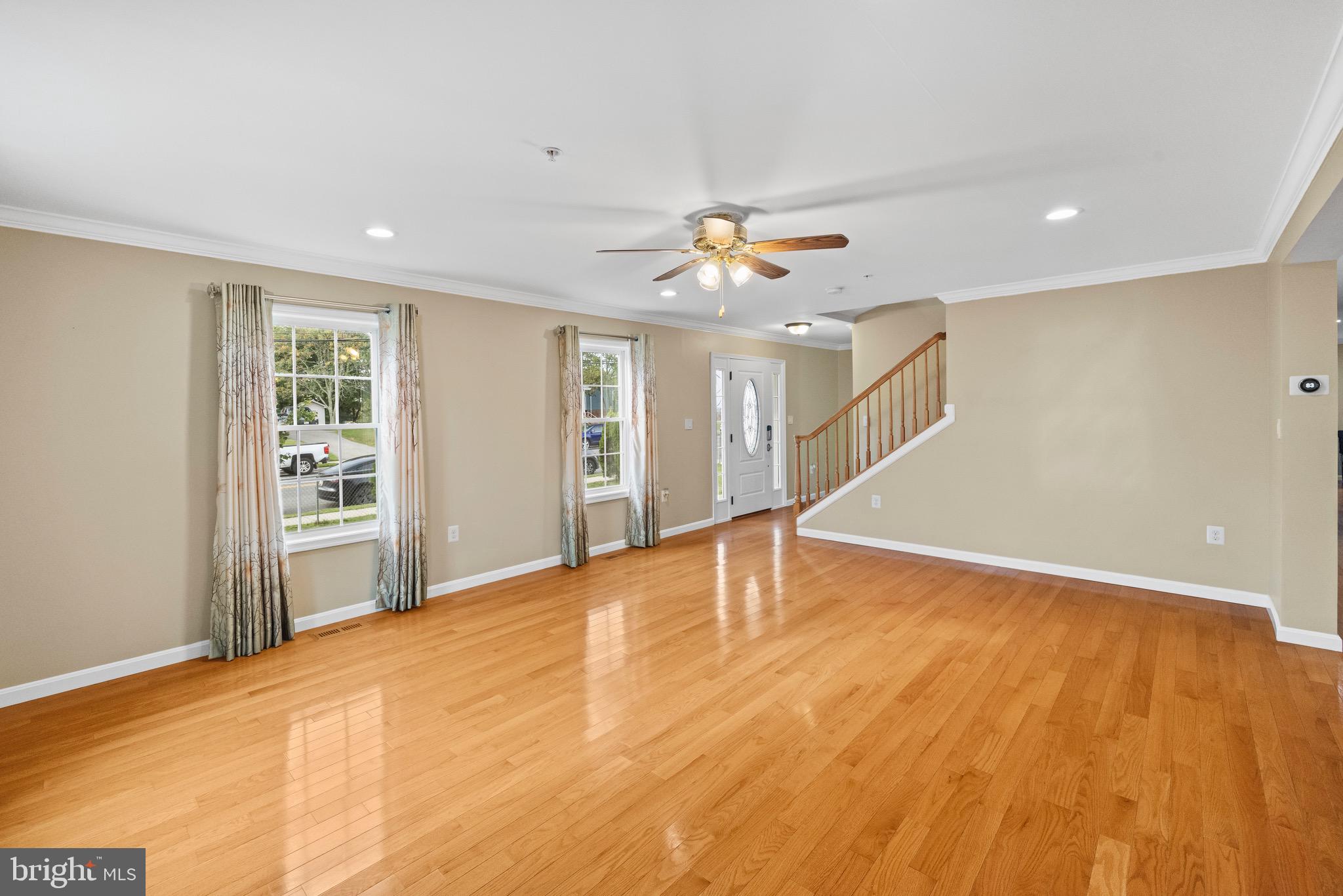 5402 Odell Road Beltsville, MD 20705 - Photo 50 of 69 a view of an empty room with a window and wooden floor