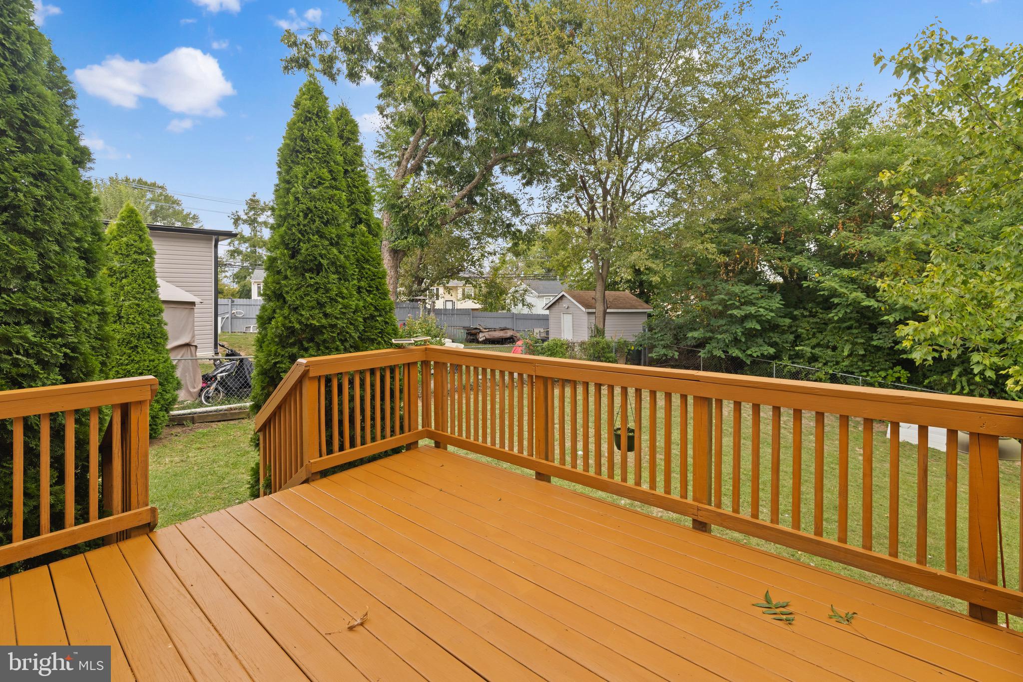 5402 Odell Road Beltsville, MD 20705 - Photo 57 of 69 a view of balcony with wooden floor and fence