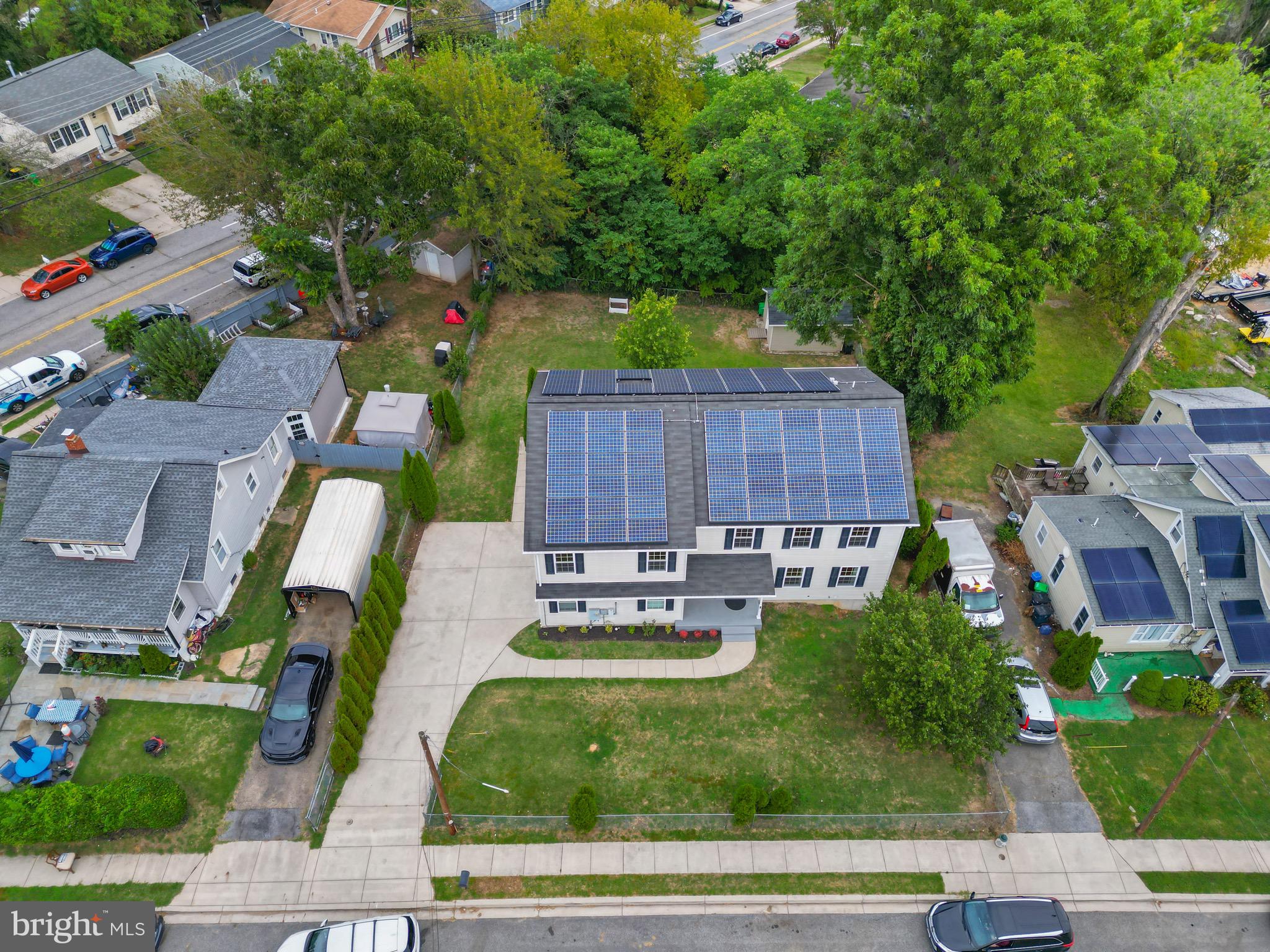 5402 Odell Road Beltsville, MD 20705 - Photo 60 of 69 a view of a patio with table and chairs potted plants and large tree
