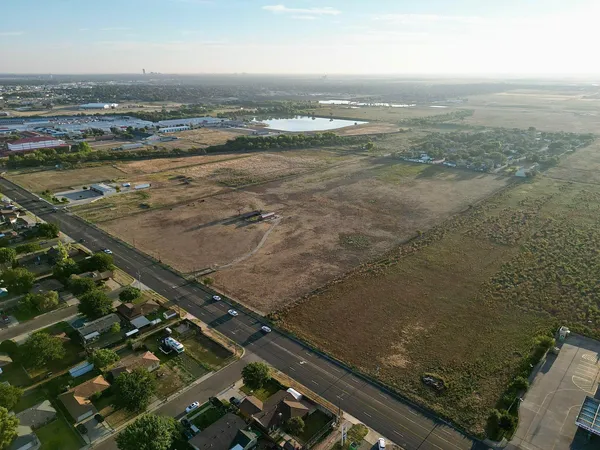 an aerial view of residential building with ocean view