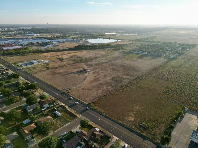an aerial view of residential building with ocean view