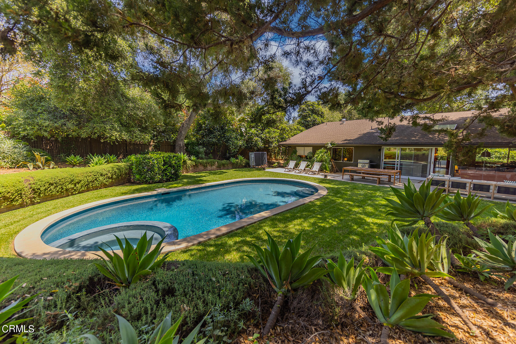 712 Cuyama Road Ojai, CA 93023 - Photo 24 of 50 a view of a swimming pool with a table and chairs under an umbrella