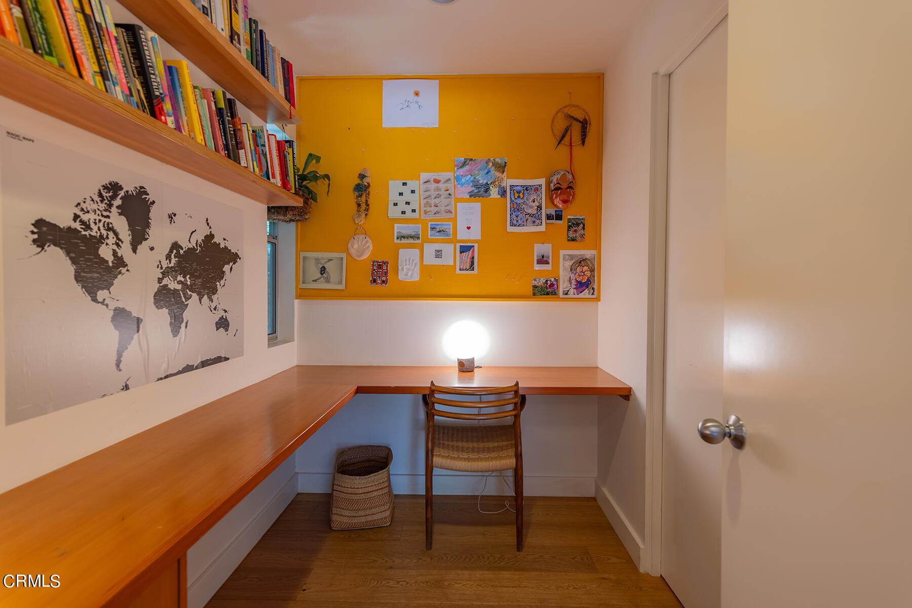 712 Cuyama Road Ojai, CA 93023 - Photo 33 of 50 a room with a table and paintings on the wall