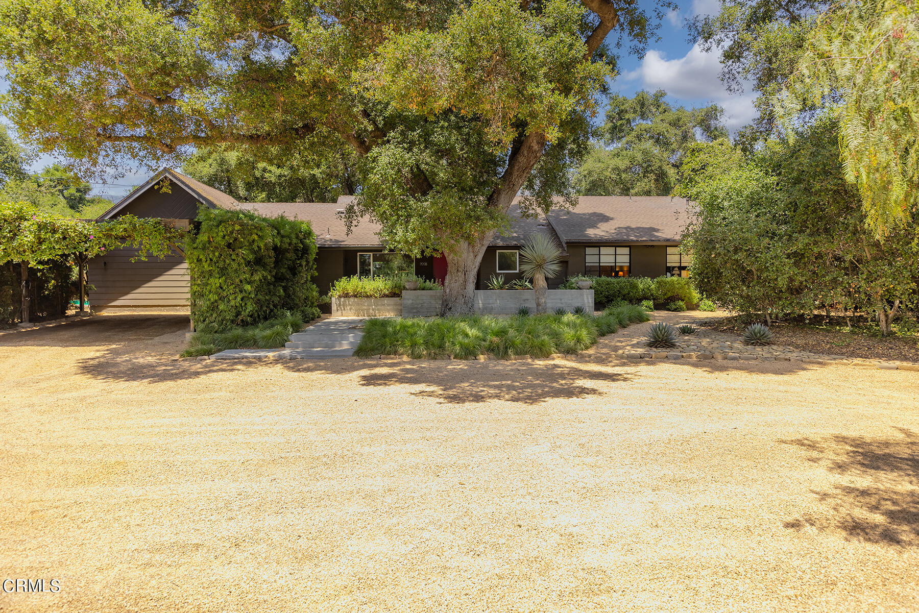 712 Cuyama Road Ojai, CA 93023 - Photo 8 of 50 a front view of a house with a yard and garage