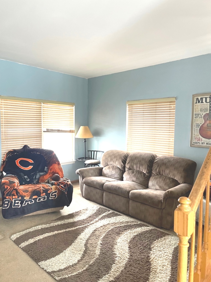 341 Richfield Trail Romeoville, IL 60446 - Photo 2 of 8 a living room with furniture and a large window