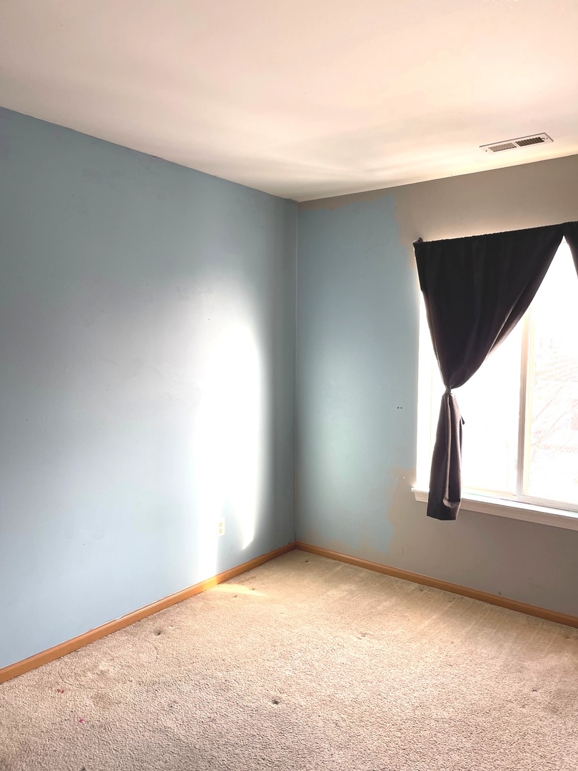 341 Richfield Trail Romeoville, IL 60446 - Photo 7 of 8 an empty room with windows