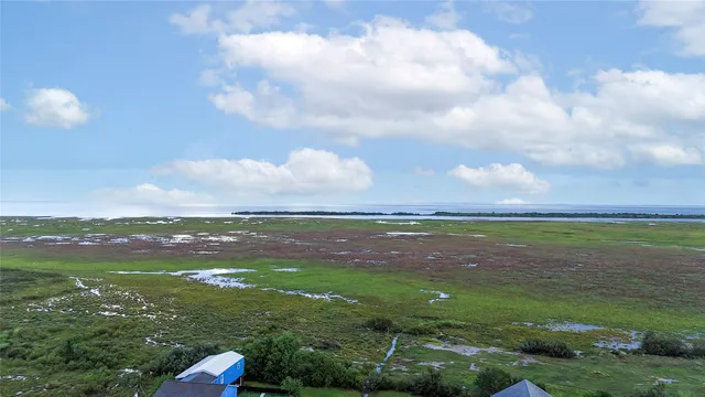 a view of a lake with a big yard