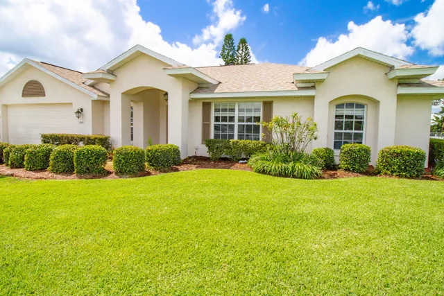 front view of a house with a yard