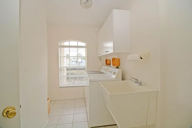 a bathroom with a bathtub sink and mirror