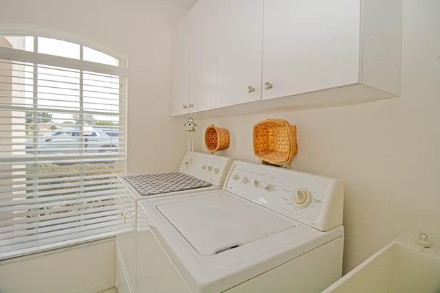 a utility room with dryer and washer