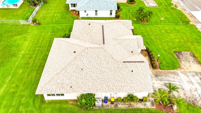 an aerial view of a house with a garden